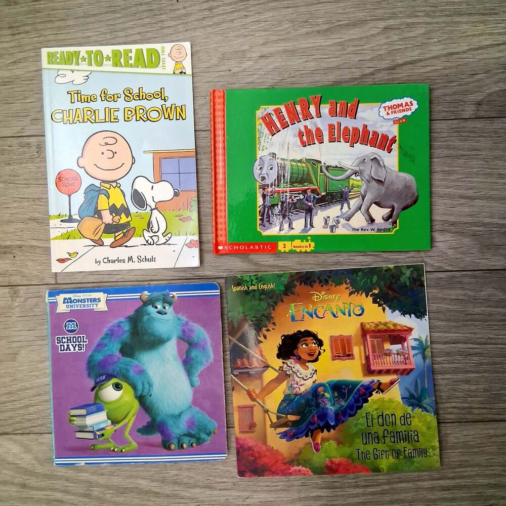 Lot of 4 Childrens Books Thomas & Friends Encanto Charlie Brown Monsters Univers
